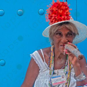 Cuban woman portrait with cats and a cigar