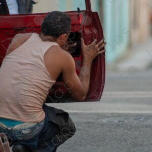 Man repairing a car door