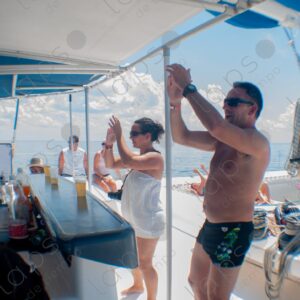 Party on a yacht, with crew and tourists
