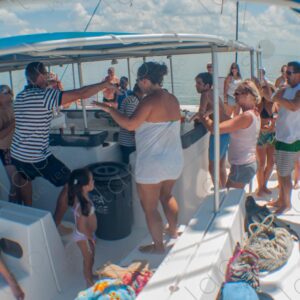 Party on a yacht, with crew and tourists