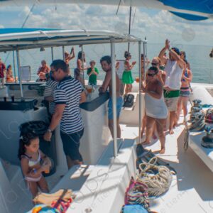 Party on a yacht, with crew and tourists