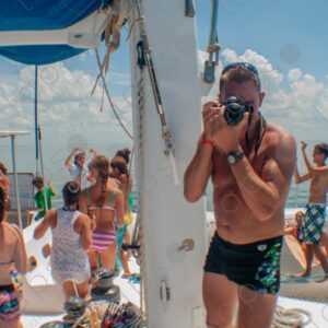 Party on a yacht, with crew and tourists