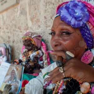 Portrait of a Cuban lady's face and nails with a cigar (habano)