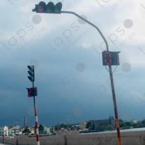 Traffic lights with gray clouds