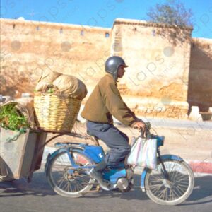 Man Riding Motorcycle through Rabat