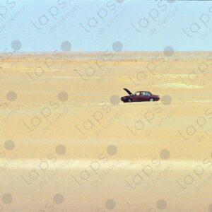 Peugeot 404 in the middle of the desert, cooling down