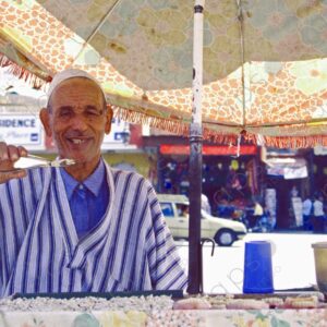 Tooth Vendor in Islamic Attire Portrait Jemaa el Fna Square Marrakech 1