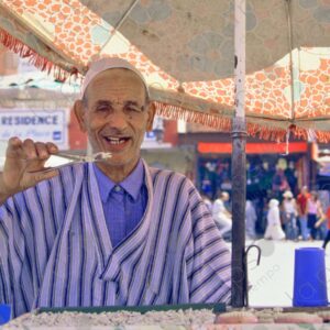 Tooth Vendor in Islamic Attire Portrait Jemaa el Fna Square Marrakech 2