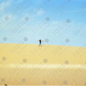 Woman standing on a dune in Western Sahara