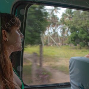 A female tourist looking out of the bus window 2
