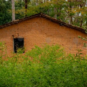 Adobe house with a small window