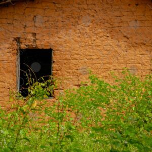 Adobe wall with a small window