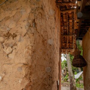 Adobe wall with rustic wooden structure 3