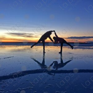 Adult and Child Holding Hands at Sunrise in Uyuni Salar