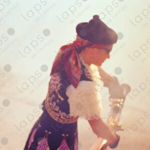 An out of focus woman fires a blunderbuss