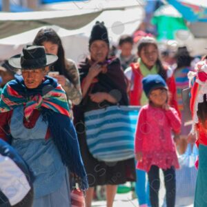 Bolivian people and indigenous individuals walking through the textile market 1