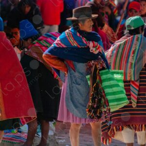 Bolivian people and indigenous individuals walking through the textile market 3