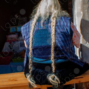 Bolivian woman from back with white braided hair 2