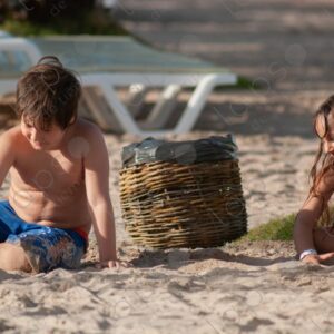 Boy and girl playing with sand