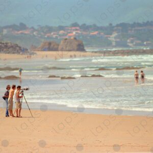 Boys with telephoto lenses on Biarritz beach