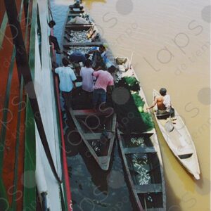 Canoes and fishing boat next to the ship