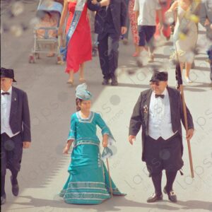 Caudete festivities parades Spaniards with a girl dressed in light blue