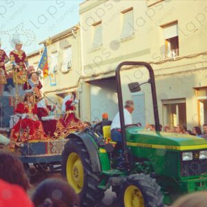 Caudete festivities parades float with Spaniards townspeople sitting