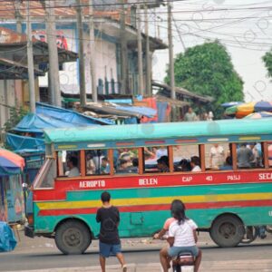 Colorful public bus passing by the market