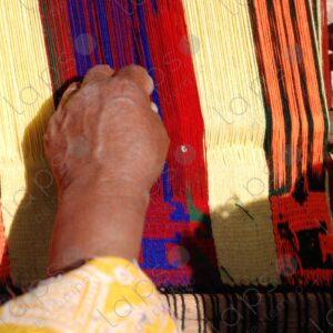 Detail of hands working on a loom 1