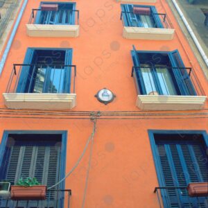 Facade of the salmon-colored building in Pamplona