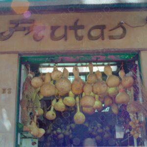 Fruit shop, entrance with hanging pumpkins, Madrid 2