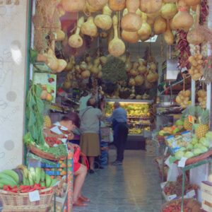 Fruit shop, entrance with hanging pumpkins, Madrid 3