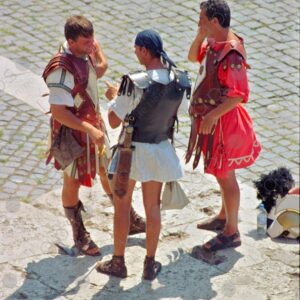 Gladiators for tourist photos in front of the Roman coliseum, Rome Italy