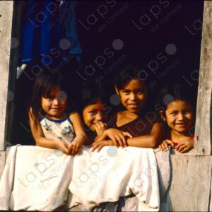 Group of girls at the window of the wooden house 2