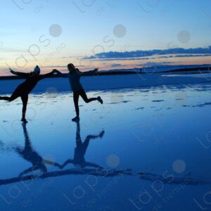 Hand-in-Hand Couple at Sunrise in Uyuni