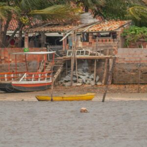 House and barges on the river