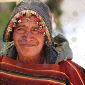 Indigenous man with a poncho and a Tarabuco helmet