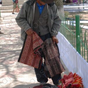 Man shows ancestral woven fabrics