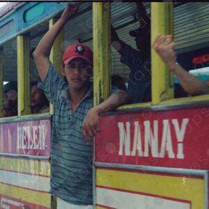 Man standing at the door of a public bus