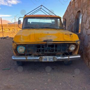 Old yellow truck in the desert
