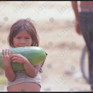 Portrait of a girl carrying a watermelon