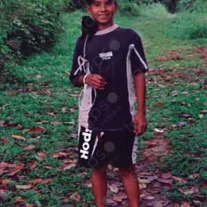 Portrait of a young local man with his monkey