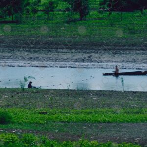 River landscape and fishermen with nets backlit