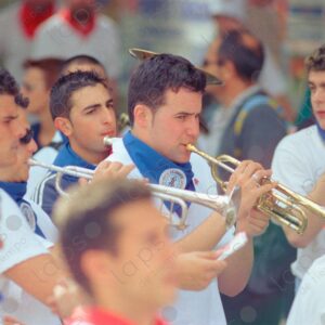 San Fermín, children playing trumpets among many people, Pamplona