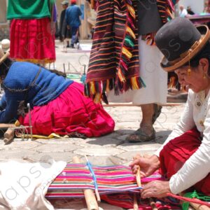 Several weavers on the floor with their looms weaving 1