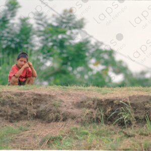 The crouching boy waits