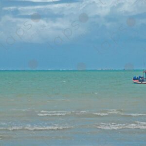 Turquoise sea a small artisanal fishing boat floating