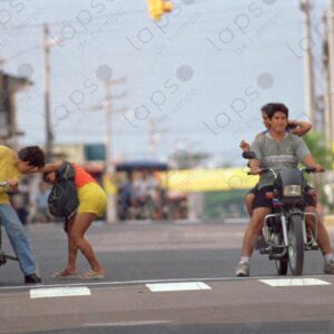 Two motorcycles stopped on the avenue