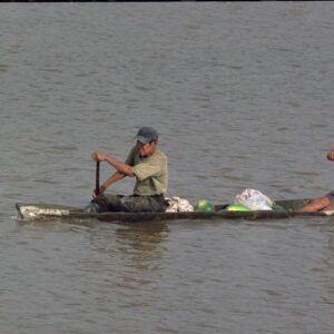 Two people traveling in a canoe