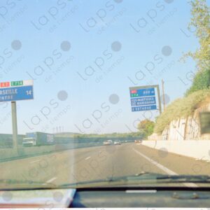 View through the windshield of the highway towards Marseille
